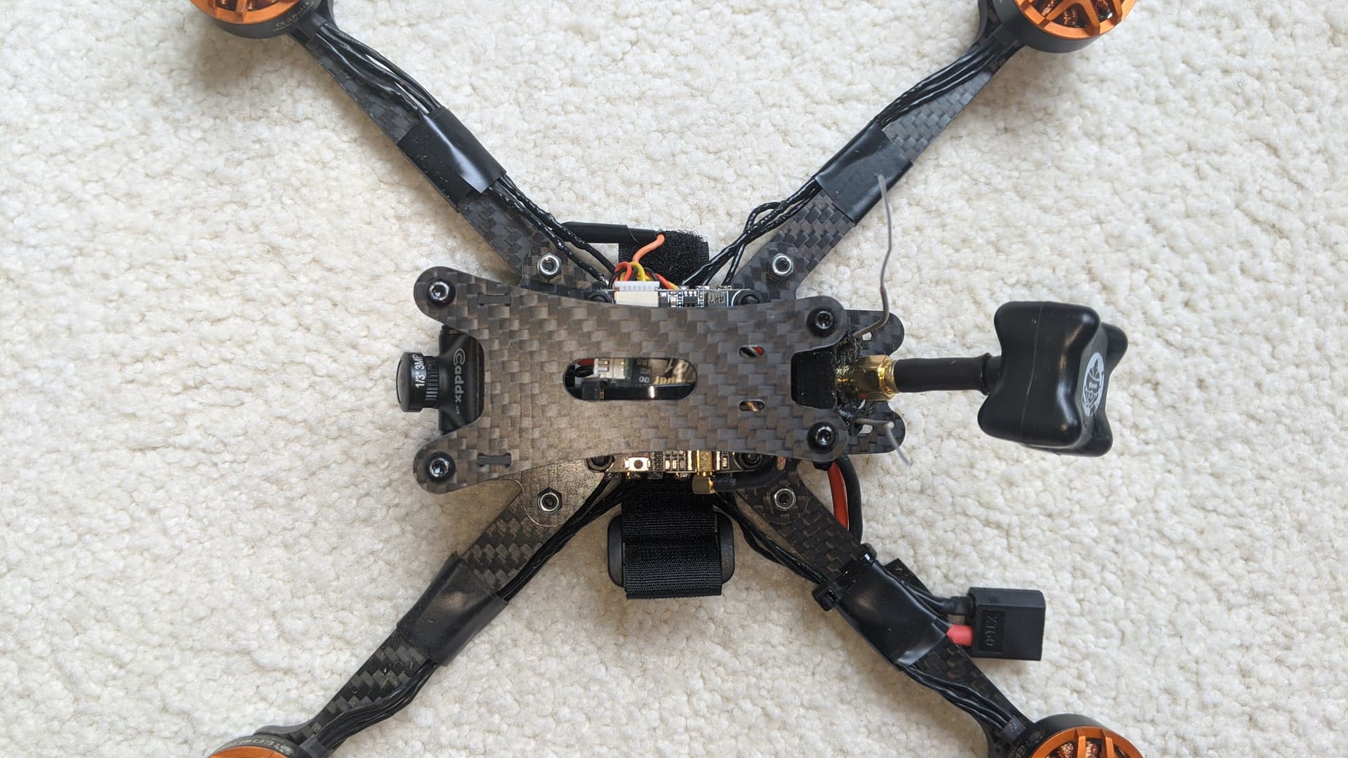 Custom FPV quadcopter assembled on a work surface